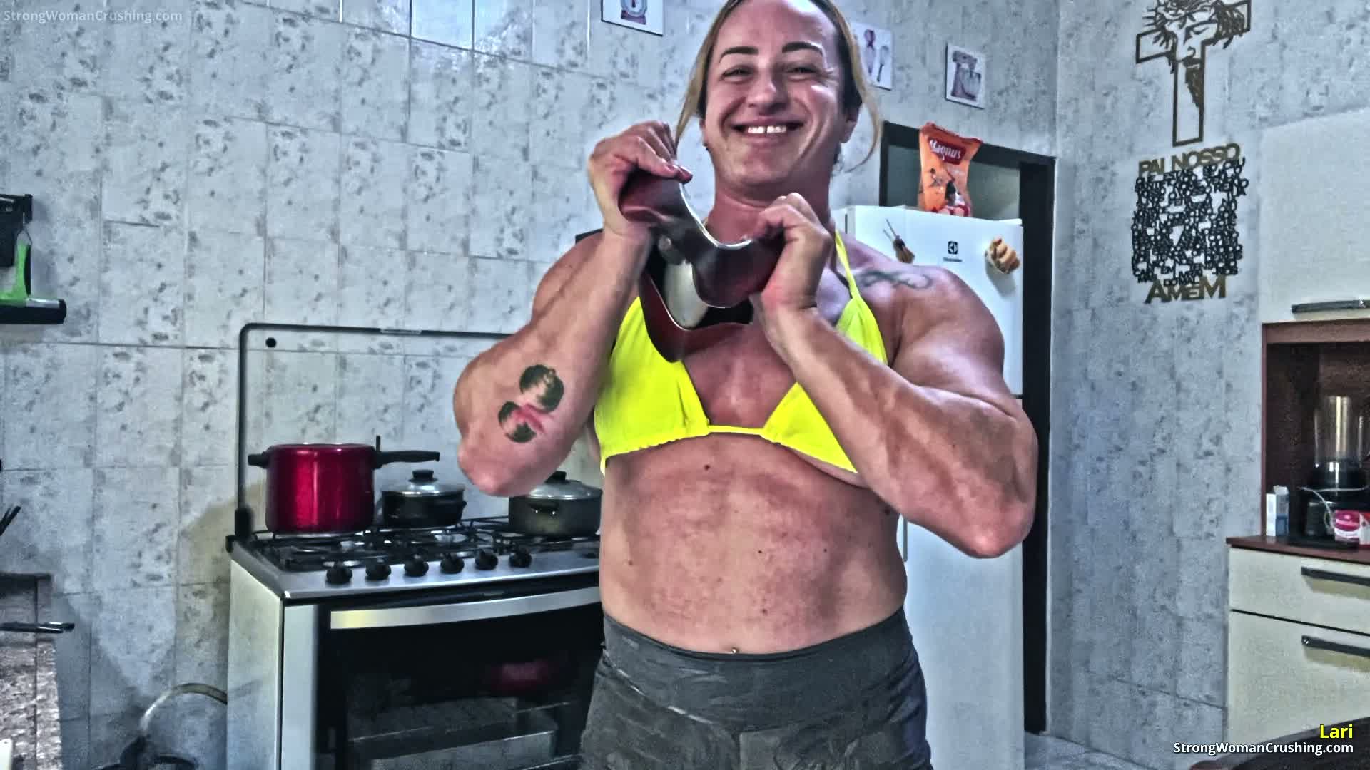 Lari Folds a Metal Pan With Her Bare Hands