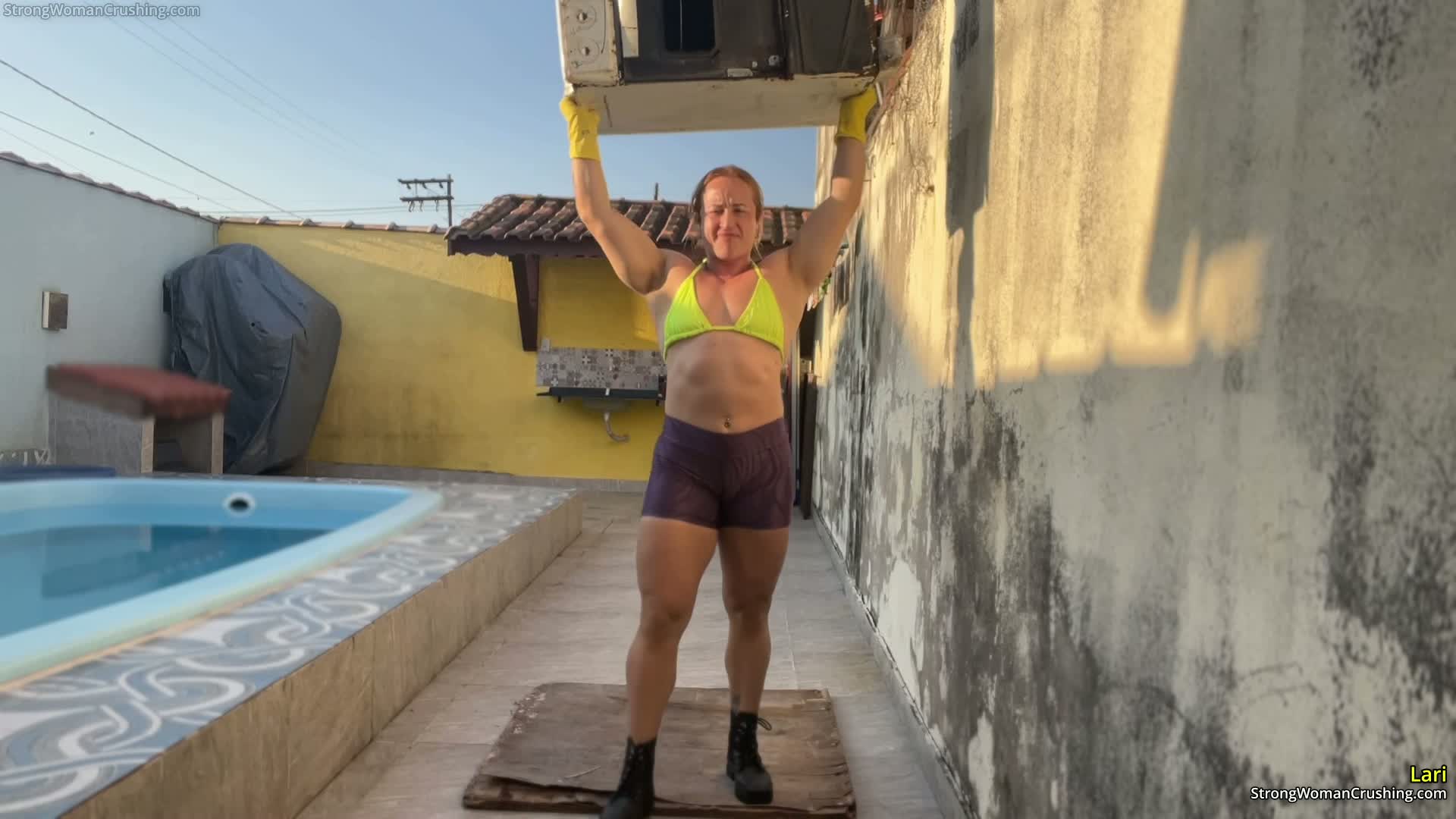 Lari lifts and destroys a metal stove
