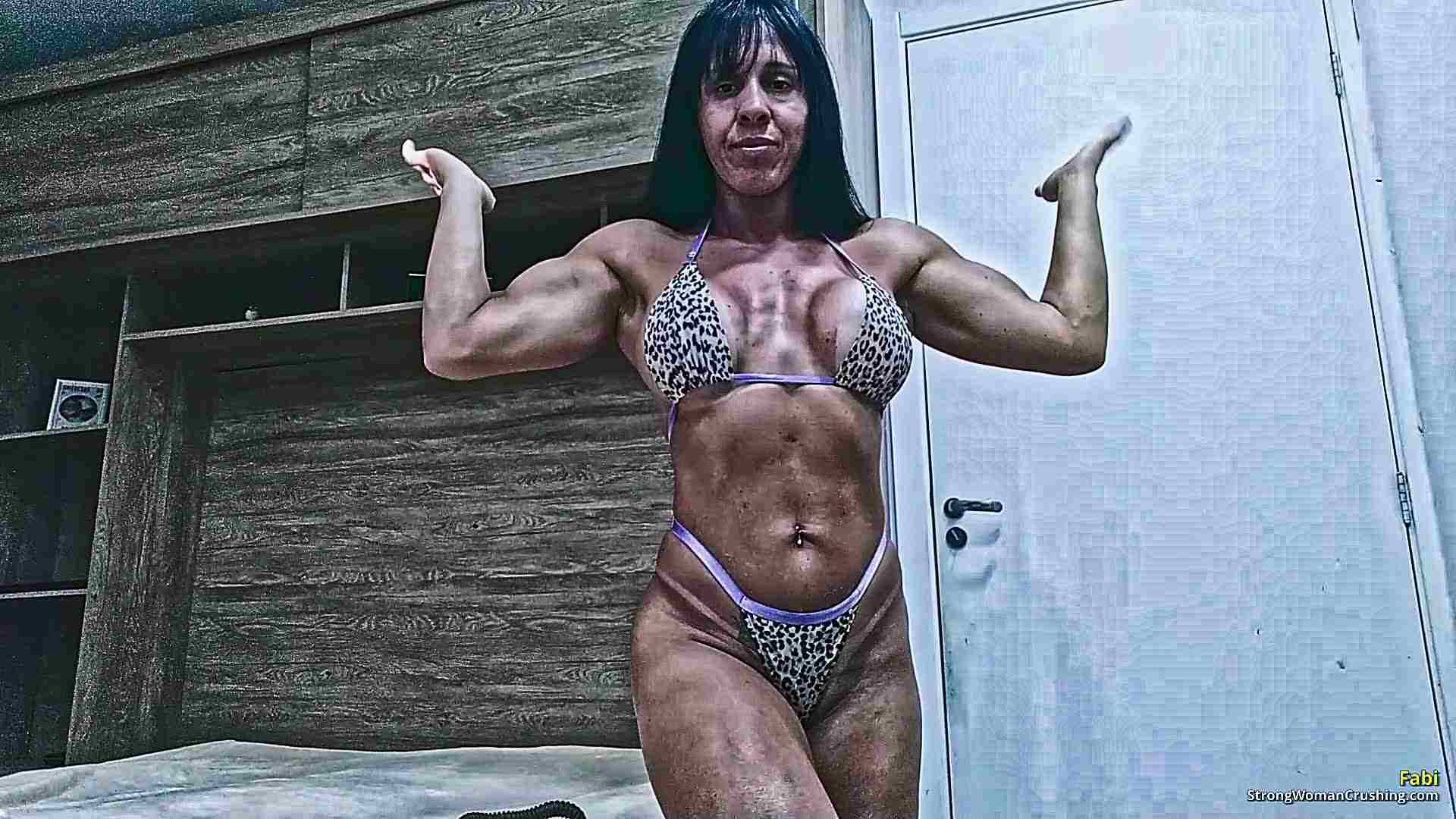 Fabi shows off her muscles and bends metal in her bedroom