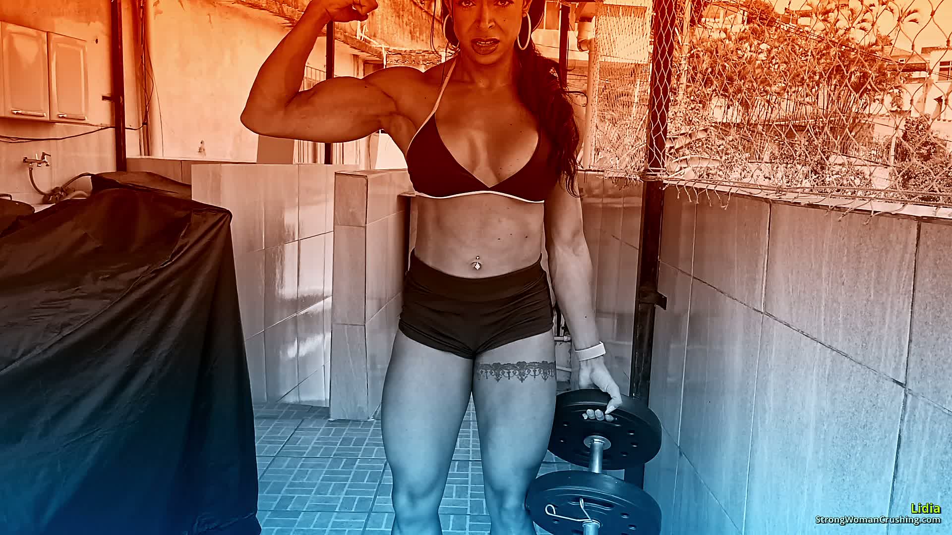 Lidia pumps her muscles