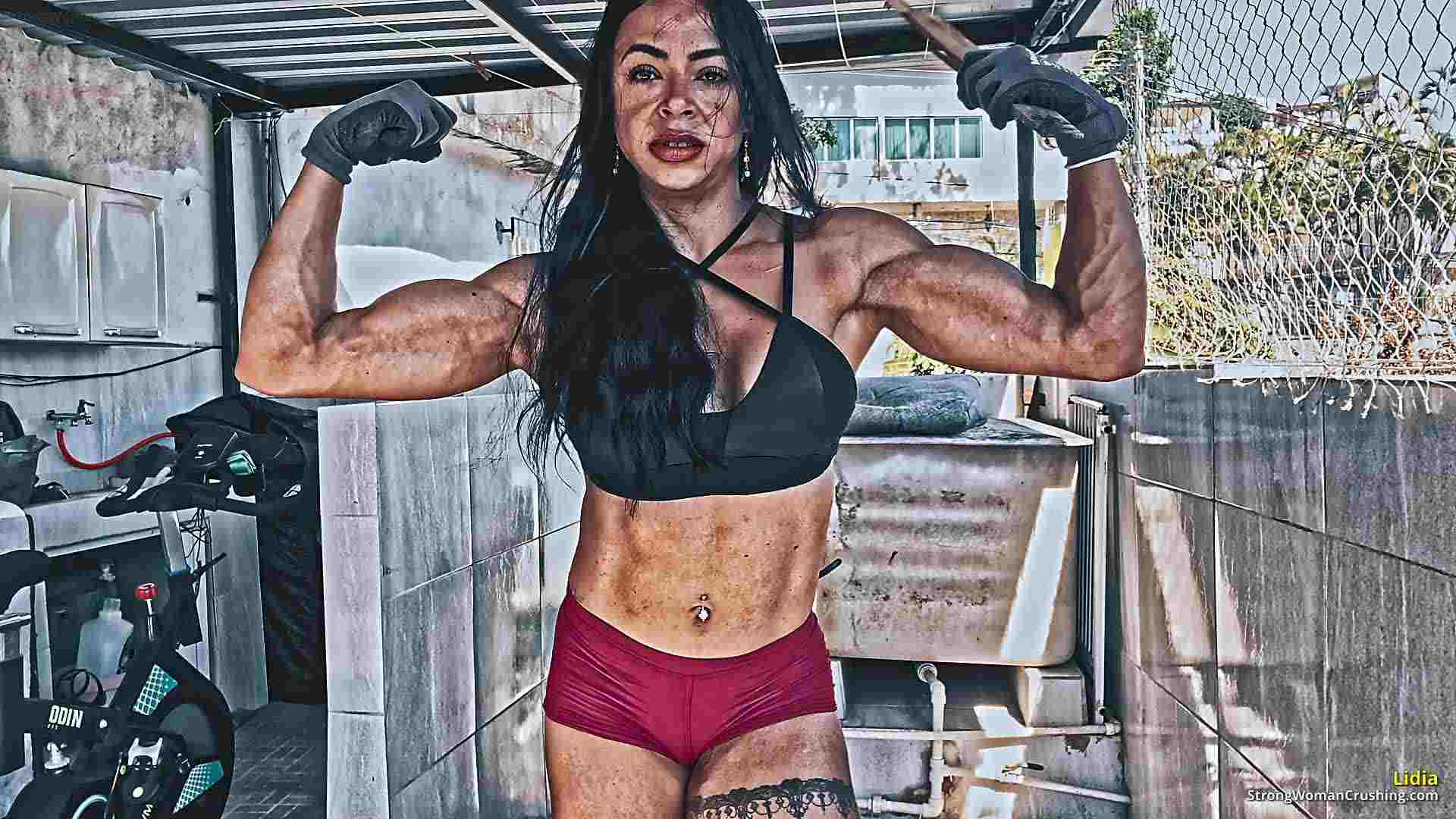 Lidia test her strength against a wooden box