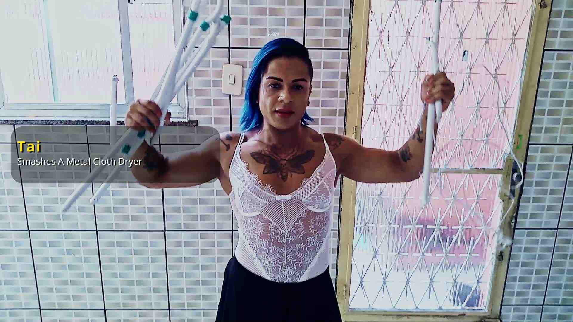 Tai smashes a metal cloth dryer